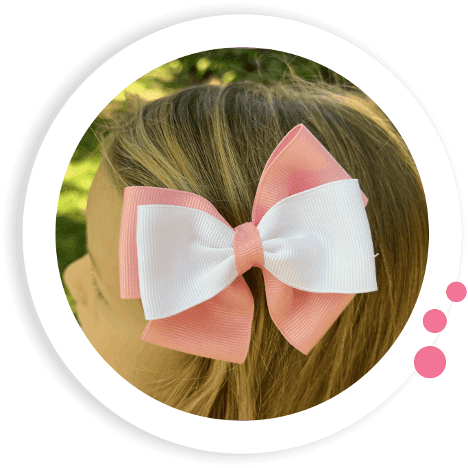 Pink and white colored Hair bow