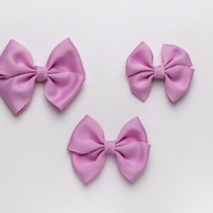 A Lilac Color Bow on a White Background